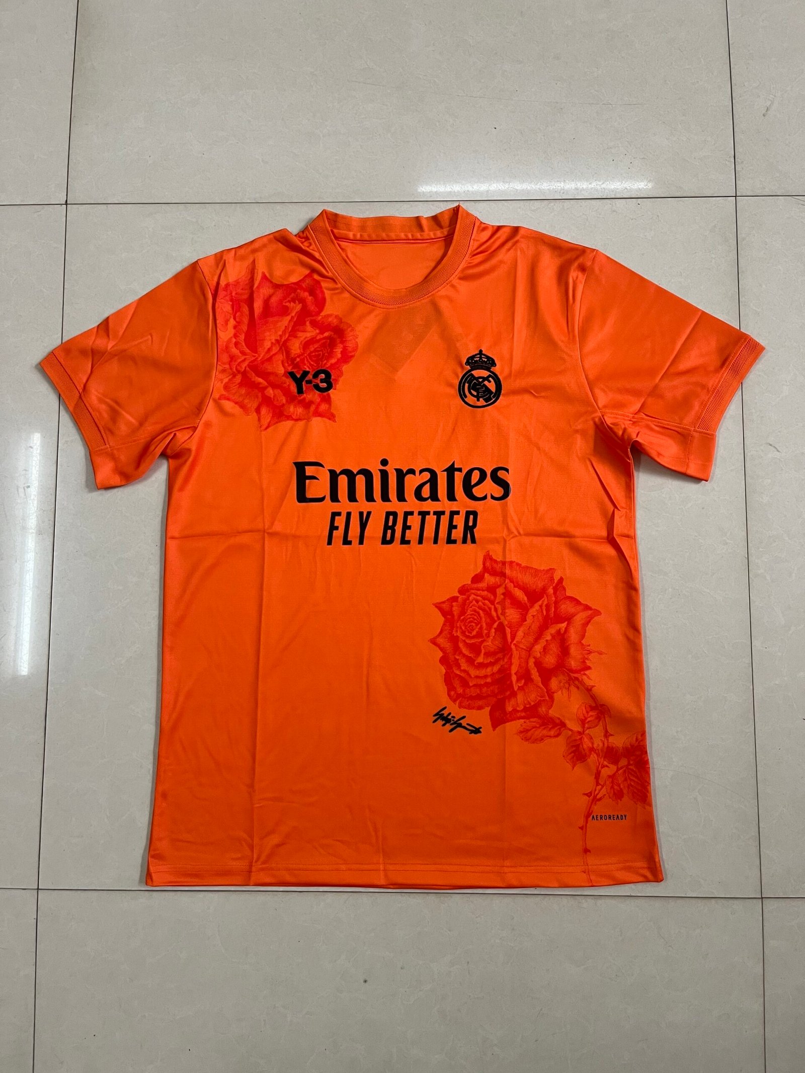 Real Madrid Rose Graphic Orange Jersey Real Madrid Rose Graphic Orange Jersey